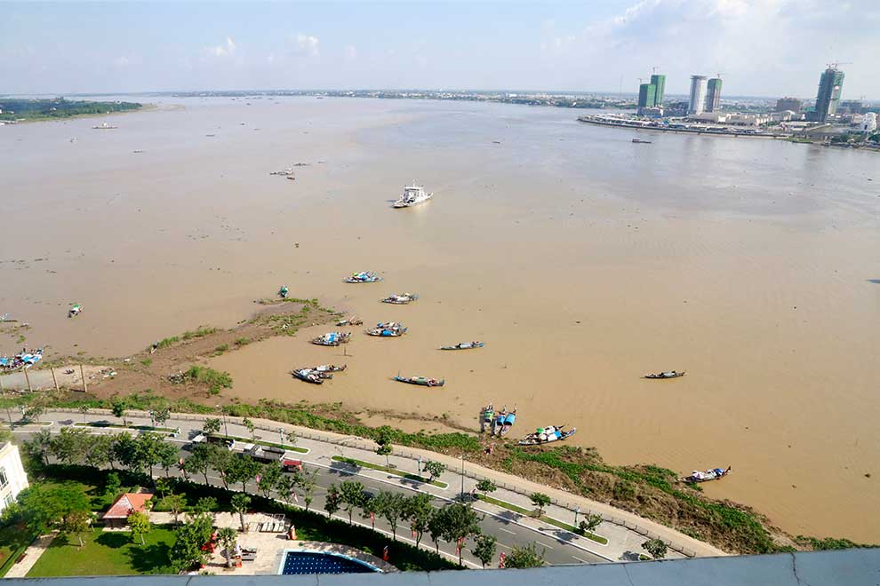Fishing boats are seen on the Mekong River in Phnom Penh in January. Heng Chivoan